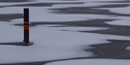 wind-blown snow creates patterns on the newly frozen surface of Black Bay on Rainy Lake