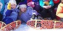 Happy kids relax in the snow during a class fieldtrip to the park.