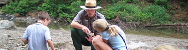Kids studying the river. NPS Photo.