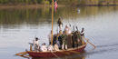 reproduction of keelboat on Arkansas River with first fort soldier reenactors reproduction of keelboat on Arkansas River with first fort soldier reenactors