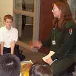 A ranger interacting with school kids