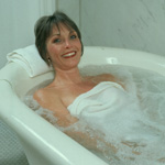 woman relaxing in old bath tub