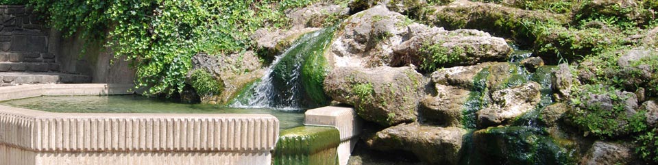 water flowing over rocks into basin