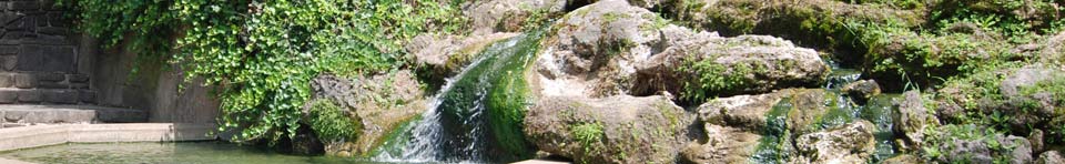 water flowing over rocks into basin