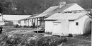 black and white photo of Rector's bathhouse, a small one story frame building near the edge of Hot Springs Creek black and white photo of Rector's bathhouse, a small one story frame building near the edge of Hot Springs Creek