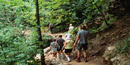 Hikers on the trail to the Indian Rockhouse shelter. Hikers on the trail to the Indian Rockhouse shelter.