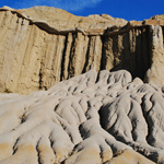 An eroded hillside of rock and clay