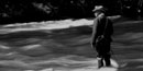Black and white photo of Herbert Hoover fly-fishing in a river. Black and white photo of Herbert Hoover fly-fishing in a river.