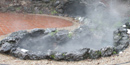 The Lamar Spring and collection pool, with brick walkway surrounding, with steam rising above. The Lamar Spring and collection pool, with brick walkway surrounding, with steam rising above.