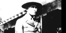 black and white head and shoulders shot of James Cary with ranger hat on and building in background black and white head and shoulders shot of James Cary with ranger hat on and building in background