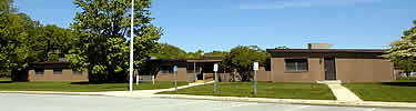office building with parking lot in front