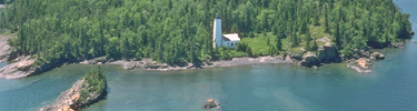 Aerial of the Rock Harbor Lighthouse and the Rock Harbor channel.