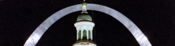Night shot of the illuminated Arch and Old Courthouse Cupola