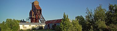 The Osceola Mine Number 13 shaft-rockhouse catches the afternoon summer sun.