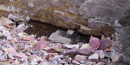 Quarry pit showing the quartzite wall and quartzite rubble pile Quarry pit showing the quartzite wall and quartzite rubble pile