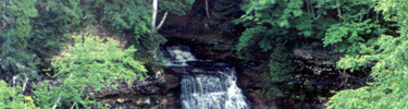 Chapel Falls begins its cascade into Chapel Lake below, one of many waterfalls in Pictured Rocks National Lakeshore.