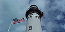 The light tower and flagpole of the Au Sable Light Station stand proudly. The light tower and flagpole of the Au Sable Light Station stand proudly.