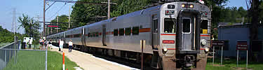 commuter train boarding passengers
