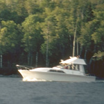 Boater heads west in the Rock Harbor Channel