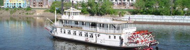 The Minneapolis Queen cruising on the Mississippi River.