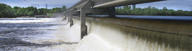 Water spills through the Coon Rapids Dam into the Mississippi River.