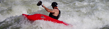 Kayaker challenges Rocky Ford rapid at high water