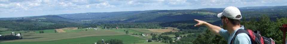A hiker enjoys the view along the North Country Trail in New York.
