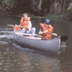 Two boys enjoying a canoe trip.