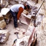 A quarrier working in his quarry pit