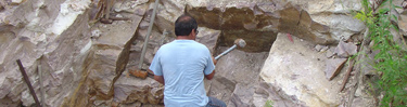 A quarrier working in his quarry pit
