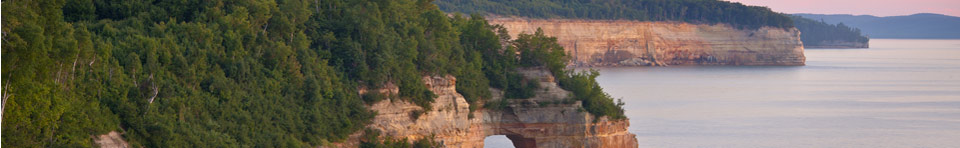 Little Portal Point at sunset.  Photo copyright Craig Blacklock