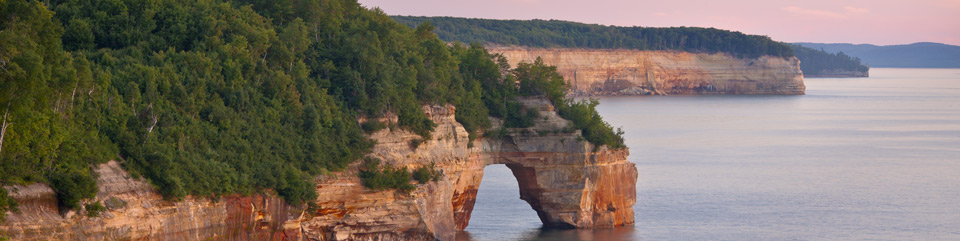 Little Portal Point at sunset.  Photo copyright Craig Blacklock