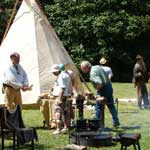 Visitors talking with demonstrators from the Tombigbee Pioneer Group.