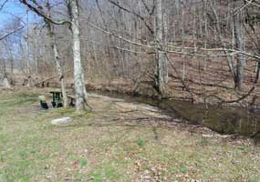 Picnic tables near the water provide a great place to take a break from your hike or ride.