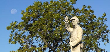A Pennsylvania monument with the moon setting
