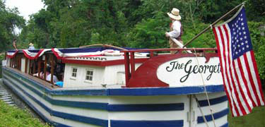 Photo of American Flag on stern of Georgetown canal boat.