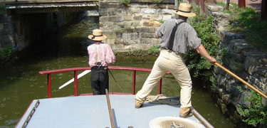 Photo of boat crew casting off in Georgetown.
