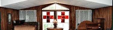 Red Cross design in original stained glass windows at Clara Barton National Historic Site.