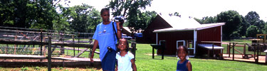 family at chicken coop