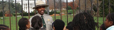 A Park Ranger is speaking to a group of visitors.
