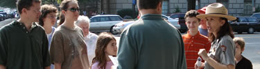 Visitors attending a park ranger's program. (NPS Photo by J. Feeney)