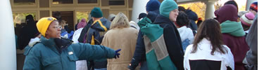 A park volunteer organizing the ticket distribution line for the Lighting of the National Christmas Tree Ceremony. (NPS Photo by J. Feeney)