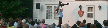 An audience enjoys a Pre-Performance Preview before an evening dance show.