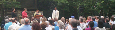 An audience enjoys a Pre-Performance Preview before an evening show.