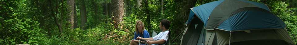 Campers relaxing at their site