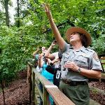 Ranger leading group on bird hike.