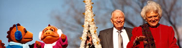 In 1988 Barbara Bush and Joseph Riley topped the tree with two literacy puppets, Rex and Rita Readasaurus