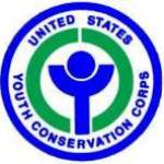 Youth Conservation Corps logo, round with text at border surrounding a stylized 