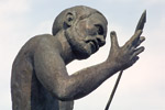 A statue of African-American blacksmith Lewis Temple holding his invention, the Toggle Iron.