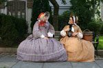 Two costumed interpreters discuss the issues of the day and life in the bustling whaling port.